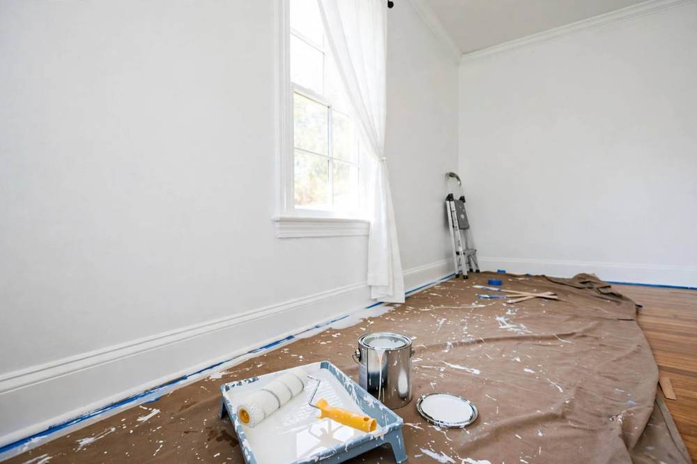 Interior painting in progress on a room wall in a San Fernando home remodel.